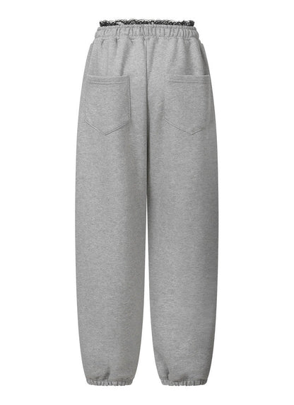 MUCENT ASTO LACE SAGGING JOGGER PANTS 蕾絲拼接落檔縮口褲 2色